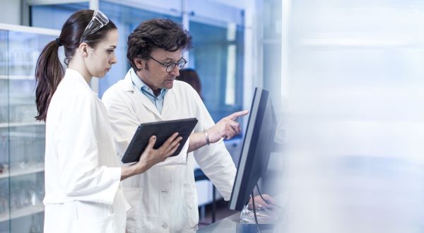 Two engineers performing a systems quality check